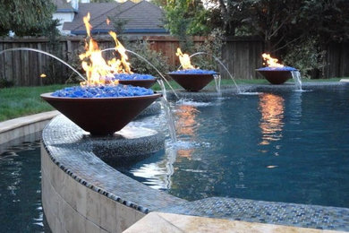 This is an example of a traditional backyard pool in Sacramento with concrete slab.