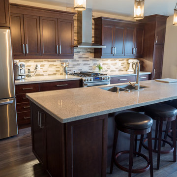 Falsetta - Brown Cabinets with Mosaic Tile Backsplash