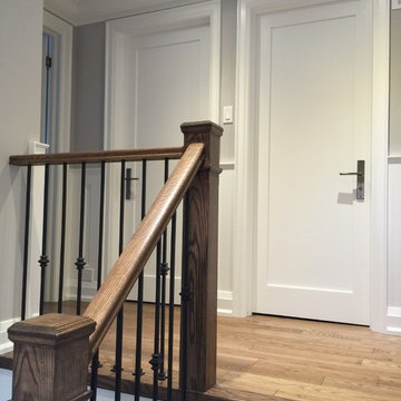 Espresso Stained Oak Staircase w/ Wainscoting, doors & trim