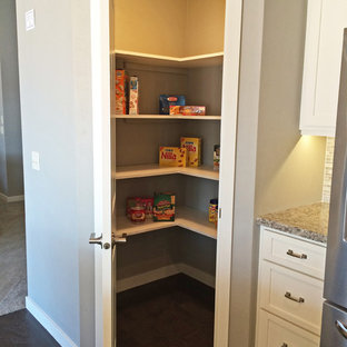 Mid-sized contemporary kitchen pantry appliance - Kitchen pantry - mid-sized contemporary dark wood floor kitchen pantry idea in Milwaukee with shaker cabinets, white cabinets, a double-bowl sink, wood countertops and stainless steel appliances