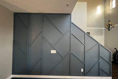 Large minimalist open concept ceramic tile, brown floor and wood wall family room photo in Phoenix with blue walls, no fireplace and no tv