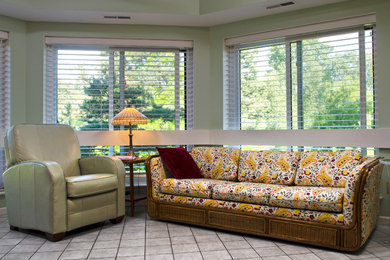Example of a mid-sized classic formal and enclosed ceramic tile living room design in Detroit with green walls, no fireplace and no tv