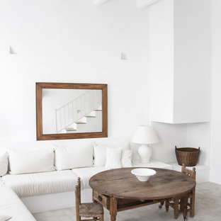 Design ideas for a medium sized mediterranean open plan living room in Barcelona with white walls, no fireplace and no tv.