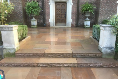Inspiration for a rustic courtyard stone landscaping in Toronto.