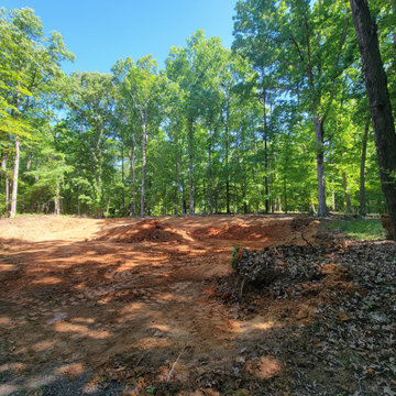 Before: Grading and Land Prep in Wooded Lot