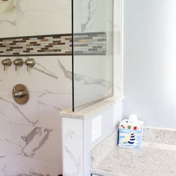 Gray Vanity with Freestanding Tub and Tiled Walkin Shower