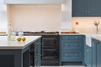 Inspiration for a large transitional kitchen in Other with shaker cabinets, quartzite benchtops, white splashback, with island and white benchtop.