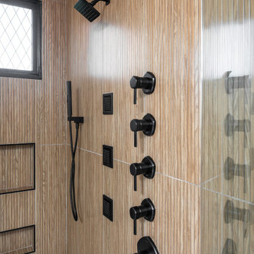 Modern Luxury Master Bathroom with Black Solid Surface Tub
