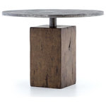 Four Hands - Boomer Bistro Table - Shape and texture blend for instantaneous impact. A rectangular slab of weathered reclaimed woods provide a solid base to offset a slender aluminum neck before dramatically brimming into a round tabletop. Light gunmetal finish reveals industrial texture and metallic edge.