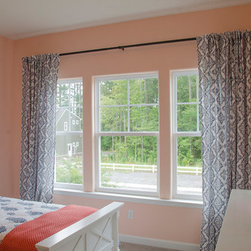 Three single-hung windows bring in the light in child's bedroom