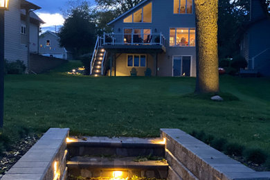 This is an example of a large traditional drought-tolerant and full sun hillside mulch walkway in Milwaukee for fall.