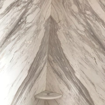 Volakas bookmatched Shower with accessories