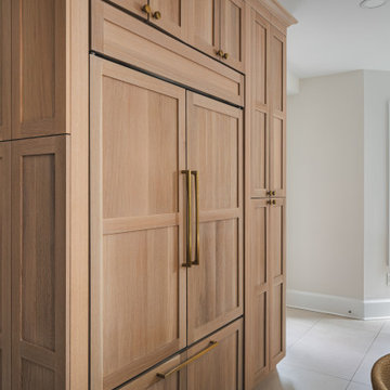 Scandinavian Kitchen with Light Oak Cabinets and Quartzite Island
