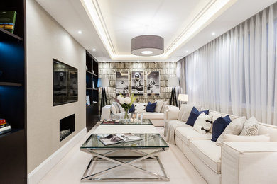 Example of a mid-sized transitional light wood floor living room library design in London with a ribbon fireplace, beige walls and a wall-mounted tv