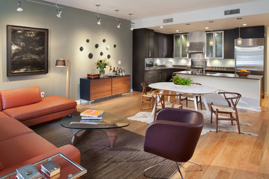 Inspiration for a mid-sized contemporary open concept medium tone wood floor living room remodel in DC Metro with gray walls