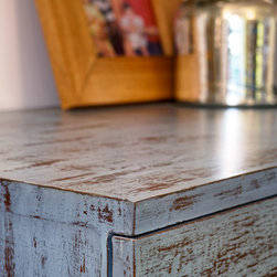 Metaphor | Close-up of chest-of-drawers in distressed wood finish - Dressers