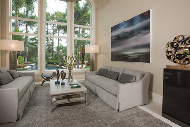 Living room - large transitional formal and enclosed limestone floor and beige floor living room idea in Tampa with beige walls