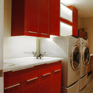 Small contemporary galley separated utility room in Kansas City with flat-panel cabinets, red cabinets, quartz worktops, white walls and a side by side washer and dryer.