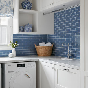 Inspiration for a small classic l-shaped utility room in Melbourne with a built-in sink, beaded cabinets, white cabinets, marble worktops, blue walls, ceramic flooring, an integrated washer and dryer, multi-coloured floors and white worktops.
