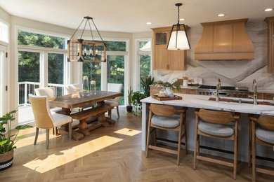 Inspiration for a large transitional medium tone wood floor and brown floor eat-in kitchen remodel in Minneapolis with recessed-panel cabinets, light wood cabinets, granite countertops, white backsplash, granite backsplash, an island and white countertops