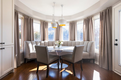 Example of a transitional dining room design in Toronto