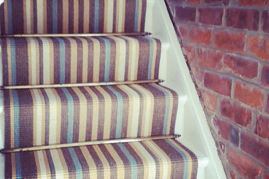kersaint cobb morroco runner with vintage stair rods, with open brick wall