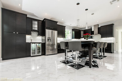 Photo of a large contemporary l-shaped eat-in kitchen in Orlando with an undermount sink, flat-panel cabinets, dark wood cabinets, quartz benchtops and with island.