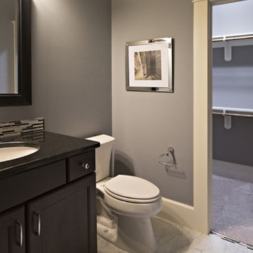 Bathroom with dark wood cabinet and contemporary tile accents