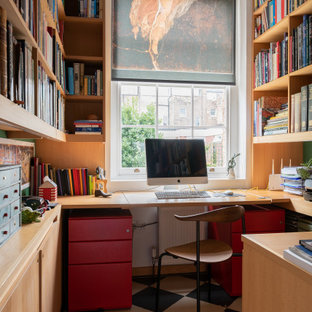 Design ideas for a medium sized traditional home office in London.