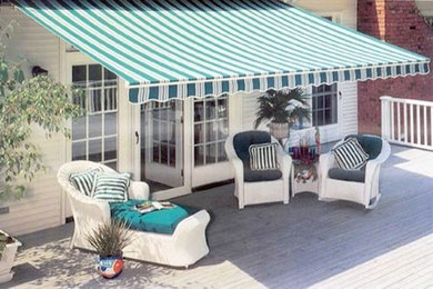Inspiration for a backyard patio in Salt Lake City with decking and an awning.
