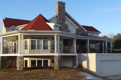 Example of a farmhouse exterior home design in Other