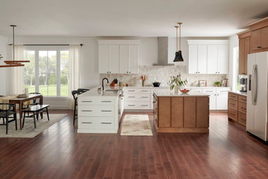 Example of a mid-sized transitional u-shaped kitchen design in Boston with an island