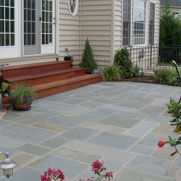 Backyard Flagstone Patio with wood steps