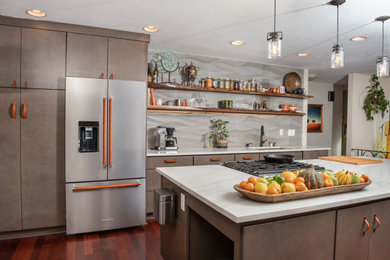 This is an example of a large contemporary galley open plan kitchen in Portland with an undermount sink, flat-panel cabinets, green cabinets, marble benchtops, grey splashback, cement tile splashback, stainless steel appliances, dark hardwood floors, with island, brown floor and grey benchtop.