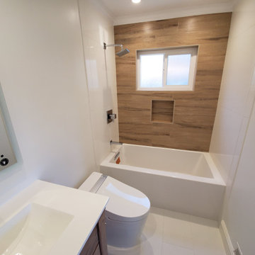 Modern Bathroom Remodel with Wood-Look Accent Tile & Tub-Shower Combo