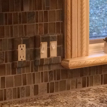 Painted switch plates match backsplash