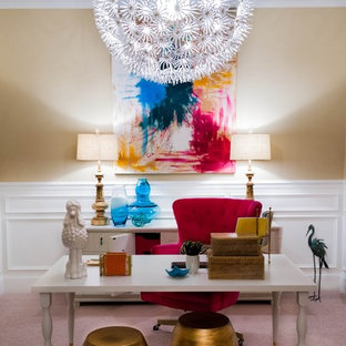 Small eclectic home office in New York with yellow walls, carpet and a freestanding desk.