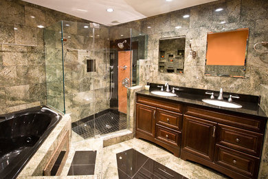 Inspiration for a large traditional master bathroom in Tampa with a drop-in sink, dark wood cabinets, a corner tub, a corner shower, gray tile, grey walls and marble floors.