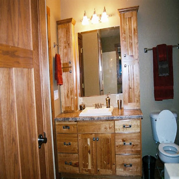 Rustic Cherry Bathroom with laminate countertops
