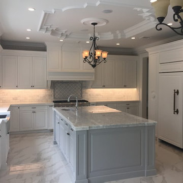 Expansive White Kitchen with Wrought Iron Detailing