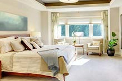 Large master bedroom photo in Philadelphia with white walls
