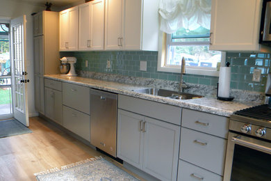 Kitchen pantry - large transitional single-wall light wood floor and yellow floor kitchen pantry idea in Other with a drop-in sink, recessed-panel cabinets, white cabinets, blue backsplash, ceramic backsplash, stainless steel appliances, no island and gray countertops