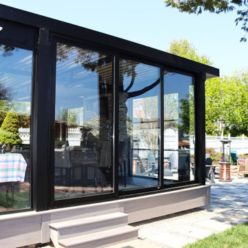 Motorized Louvered Pergola with Motorized Windows and Oversized Sliding Door