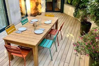 Idée de décoration pour une terrasse arrière et au rez-de-chaussée champêtre avec aucune couverture.