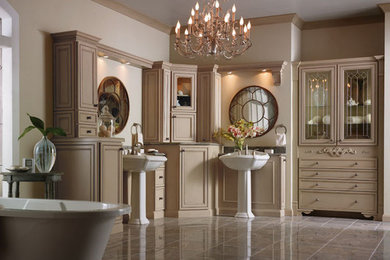 Inspiration for a large victorian master porcelain tile and brown floor freestanding bathtub remodel in Orange County with beaded inset cabinets, beige cabinets, beige walls, a pedestal sink and granite countertops
