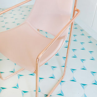 Photo of a small modern home office and library in Los Angeles with white walls, ceramic flooring and a freestanding desk.