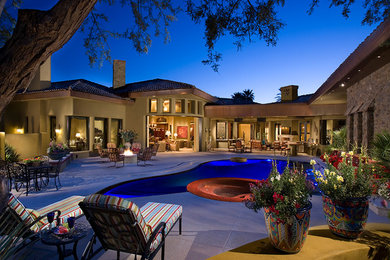 Inspiration for a huge modern beige one-story mixed siding gable roof remodel in Phoenix