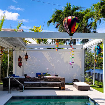 Retractable Pergola with Motorized Screens on Poolside Patio