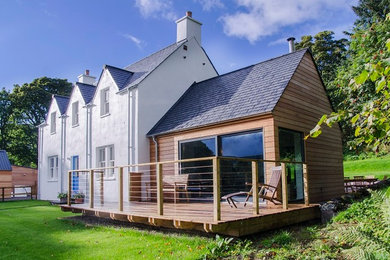 Foto de fachada de casa blanca campestre de tamaño medio de dos plantas con revestimientos combinados, tejado a dos aguas y tejado de teja de barro