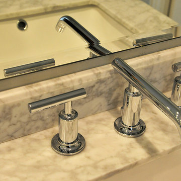 Polished Chrome Faucet on Marble Bathroom Countertop